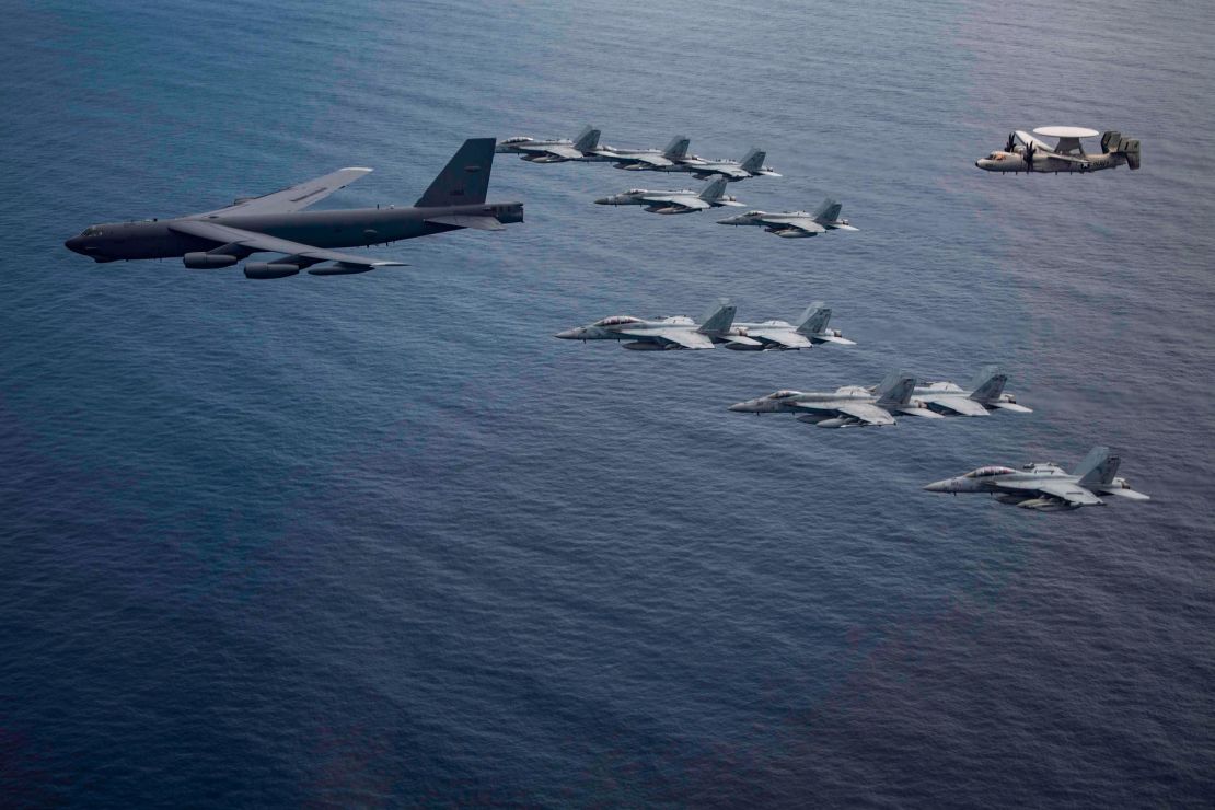 Aircraft from the Nimitz Carrier Strike Force and a B-52 Bomber from Barksdale Air Force Base in Louisiana fly over the South China Sea.