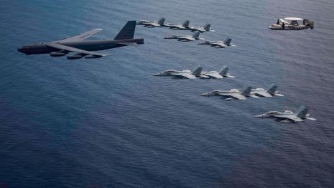 Aircraft from the Nimitz Carrier Strike Force and a B-52 Bomber from Barksdale Air Force Base in Louisiana fly over the South China Sea.