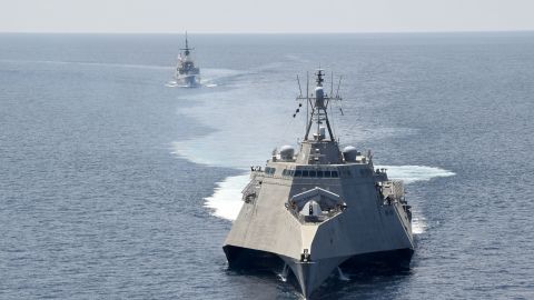 The littoral combat ship USS Gabrielle Giffords, front, exercises with the Republic of Singapore Navy Formidable-class multi-role stealth frigate RSS Steadfast in the South China Sea, on May 25, 2020. 