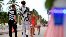 MIAMI BEACH, FLORIDA - JULY 03: People walk past restaurants on Ocean Drive on July 03, 2020 in the South Beach neighborhood of Miami Beach, Florida. In order to prevent the spread of COVID-19, Miami-Dade county has closed beaches from July 3-7 and imposed a curfew from from 10pm to 6am. (Photo by Cliff Hawkins/Getty Images)