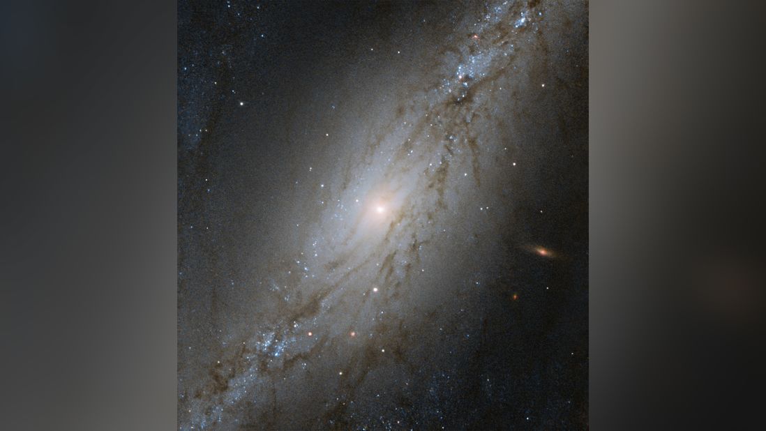 This Hubble Space Telescope image shows NGC 7513, a barred spiral galaxy 60 million light-years away. Due to the expansion of the universe, the galaxy appears to be moving away from the Milky Way at an accelerate rate.