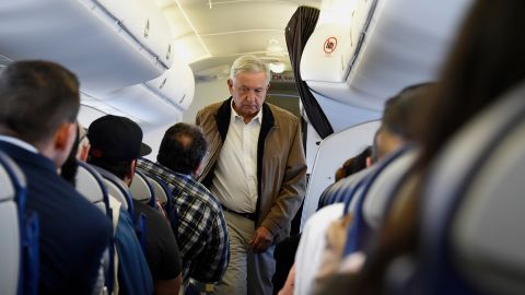 Mexican President Andres Manuel Lopez Obrador boards a commercial flight bound for Culiacan at Mexico City's international airport, on Feb. 15, 2019.