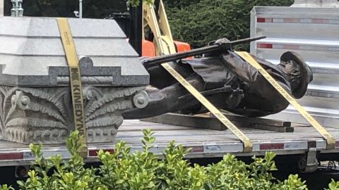 The statue of a Confederate soldier and plinth sit on a flatbed truck at the Old Capitol in Raleigh, North Carolina, on Sunday, June 21.