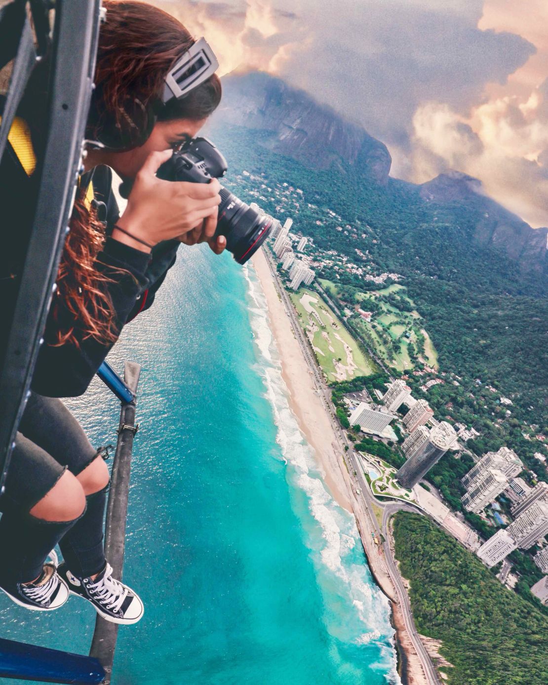 Jolie, photographing Rio de Janeiro from a helicopter.