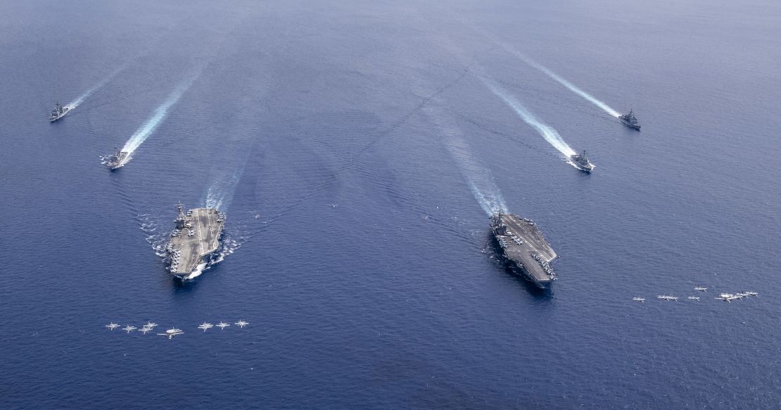 The Nimitz Carrier Strike Force composed of the USS Nimitz and USS Ronald Reagan Carrier Strike Groups conduct dual carrier operations in the South China Sea on Monday.