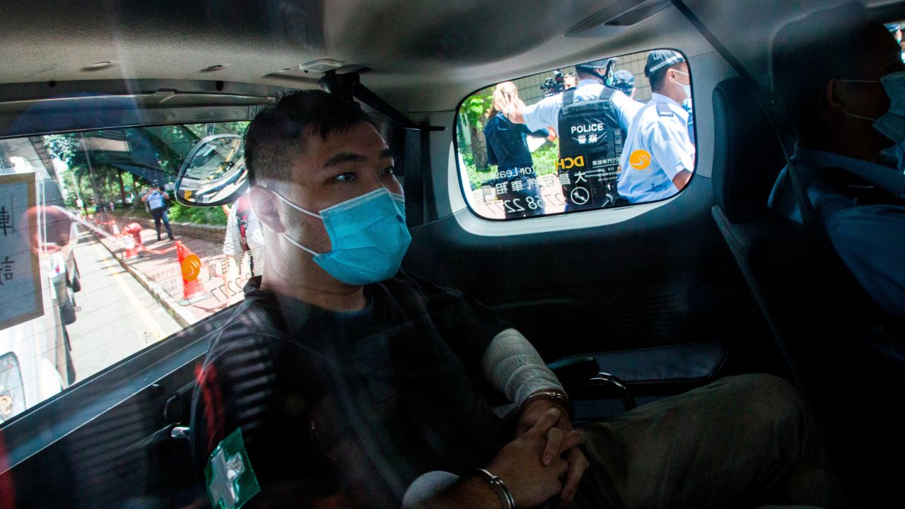 Hong Kong defendant Tong Ying-Kit arrives at court after being accused of deliberately driving his motorcycle into a group of police officers.