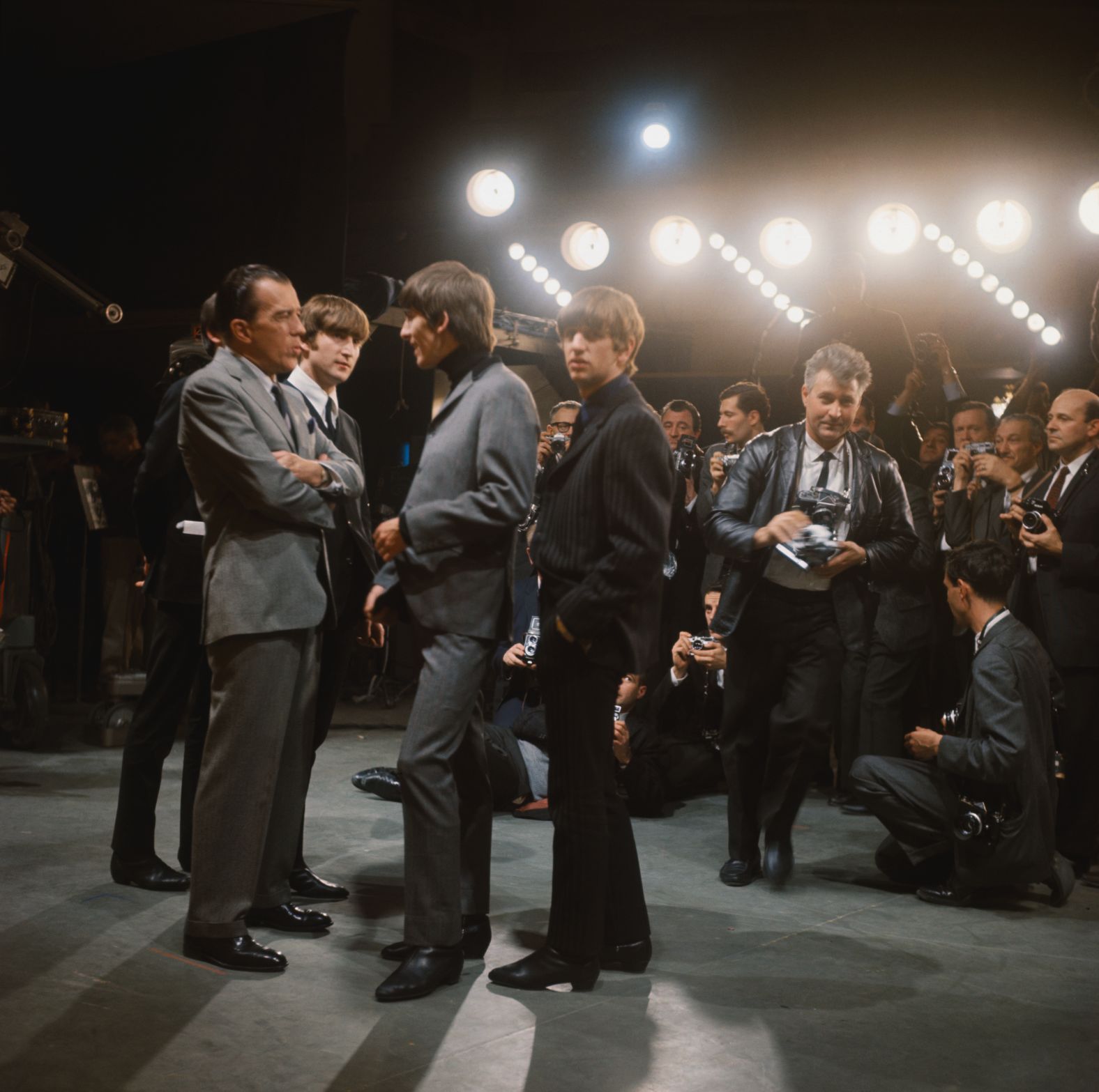 The Beatles meet with talk-show host Ed Sullivan while in New York in February 1964. It was their first appearance on the show.