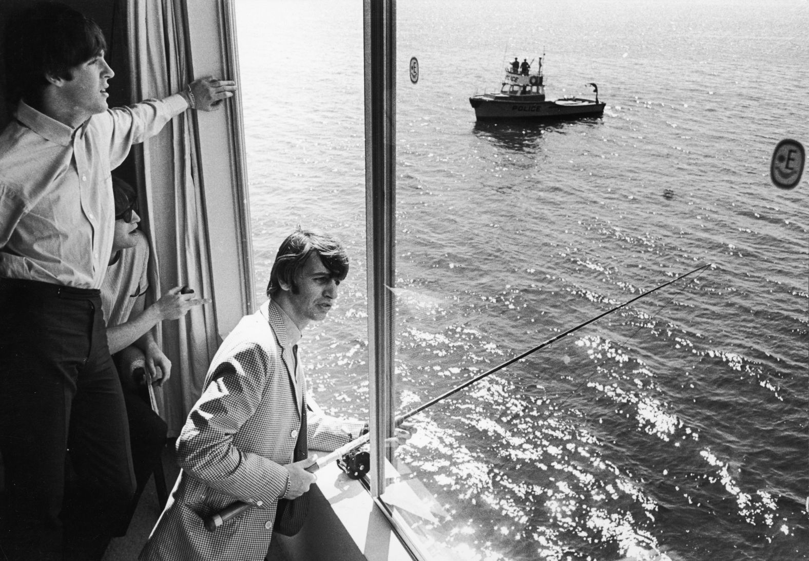 Starr uses a fishing rod from his hotel window in Seattle in August 1964.