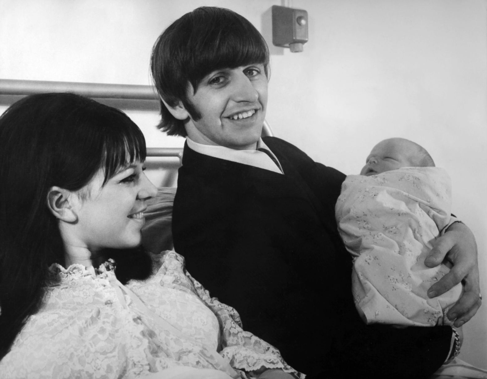 Starr holds his newborn son, Zak, in September 1965. He had three children with his first wife before they were divorced in 1975.