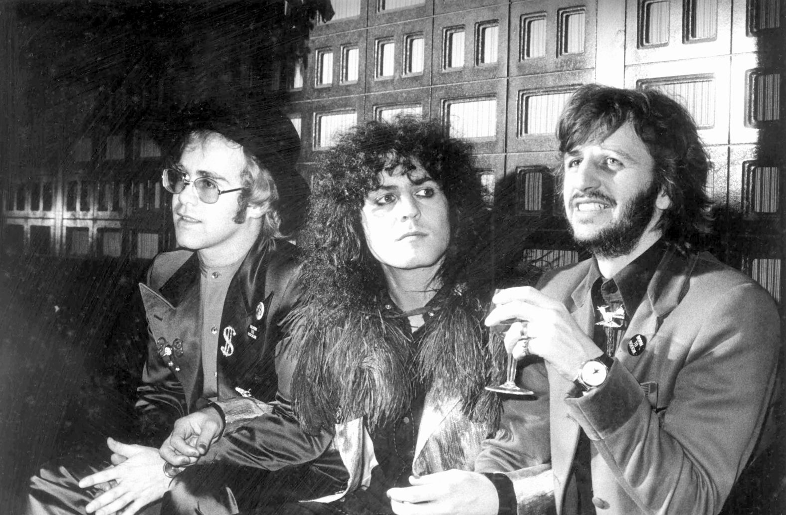 From left, Elton John, Marc Bolan and Starr have a drink together while promoting the film "Born to Boogie" in 1972.