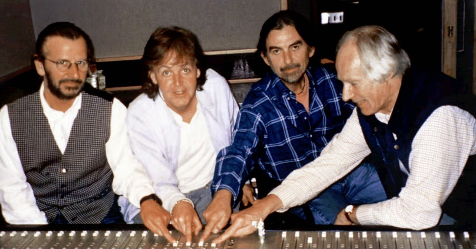 From left, Starr, McCartney, Harrison and producer George Martin get together during a recording at London's Abbey Road Studios in 1995. They worked together on a new Beatles song, "Free as a Bird."