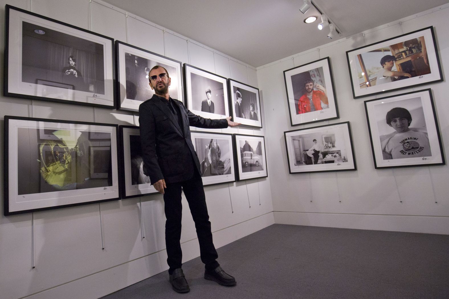 Starr attends a 2015 exhibition of photos he took during his life. He also put out a book, "Photographs."