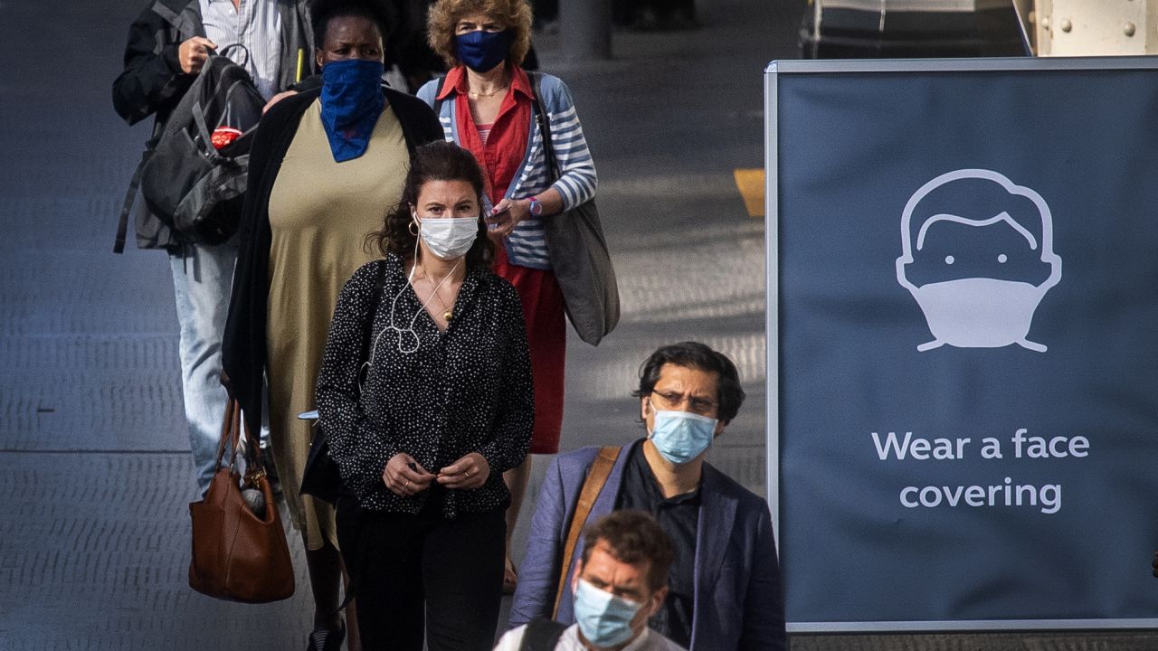 Passengers wearing face masks at Waterloo station in London as face coverings become mandatory on public transport in England with the easing of further lockdown restrictions during the coronavirus pandemic. 