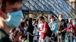 Mandatory Credit: Photo by CHRISTOPHE PETIT TESSON/EPA-EFE/Shutterstock (10703078m)
Visitors wearing protective face masks line up to enter the Louvre Museum in Paris, France, 06 July 2020. After a nearly four-months closure due to the coronavirus pandemic, the Louvre Museum reopens to public.
The Louvre Museum reopens to public, Paris, France - 06 Jul 2020
