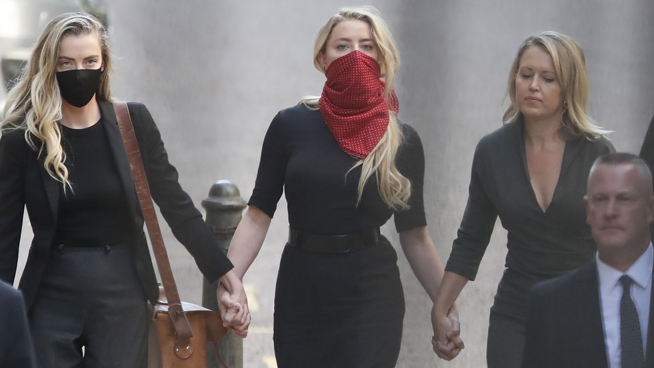 Amber Heard, center, is Depp's ex-wife.