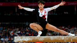 Germany's gymnast Oksana Chusovitina performs on the beam during the women's qualification of the artistic gymnastics event of the London Olympic Games on July 29, 2012 at the 02 North Greenwich Arena in London. AFP PHOTO / THOMAS COEX (Photo credit should read THOMAS COEX/AFP/GettyImages)