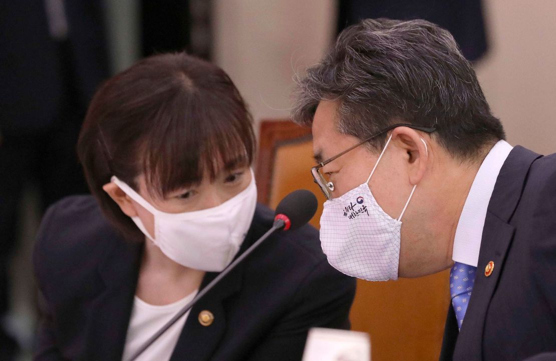 Park Yang-woo, right, minister of the Ministry of Culture, Sports and Tourism, talks with Choi Yoon-hee, left, vice minister of the Ministry of Culture, Sports and Tourism. South Korean officials have offered a public apology and vowed to delve into the death of Choi Suk-hyeon.