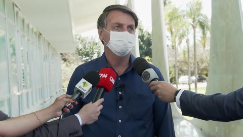 Brazilian President Jair Bolsonaro wore a mask when he told reporters about his coronavirus diagnosis.