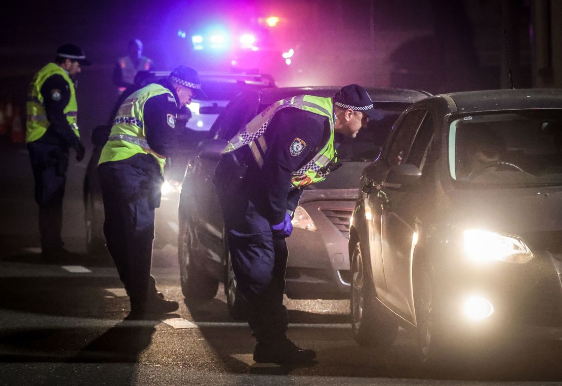 Police stop and question drivers at a checkpoint in Albury, Australia, on July 8.