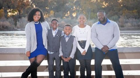 Jaime Nalls (far left) of Albuquerque, New Mexico, is shown here with her husband and three of her four children. Nalls' 9-year-old son (center) has asthma, so she hopes that he can continue some online learning in the fall.