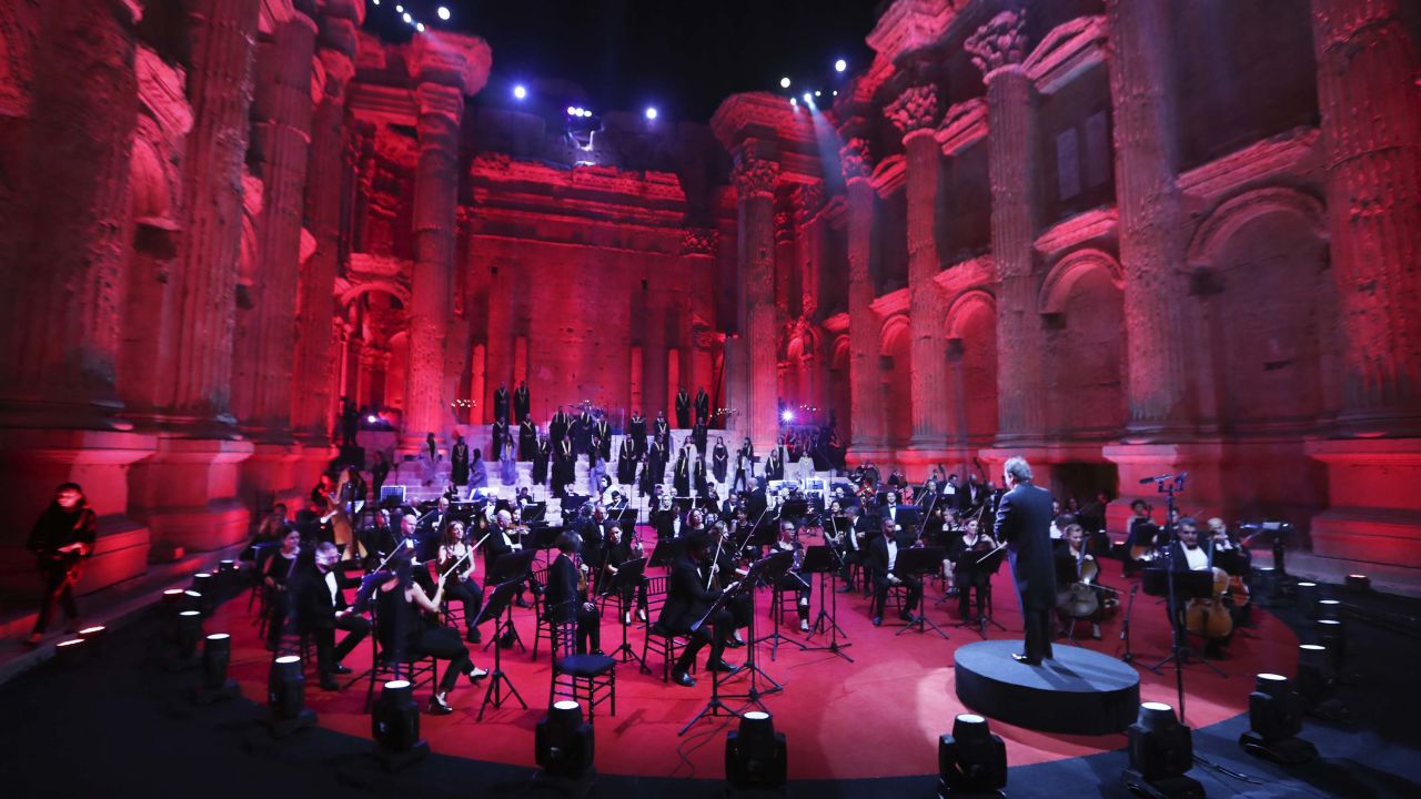 Musicians from the Lebanese Philharmonic Orchestra perform during a concert in the ancient northeastern city of Baalbek, Lebanon, Sunday, July 5, 2020.