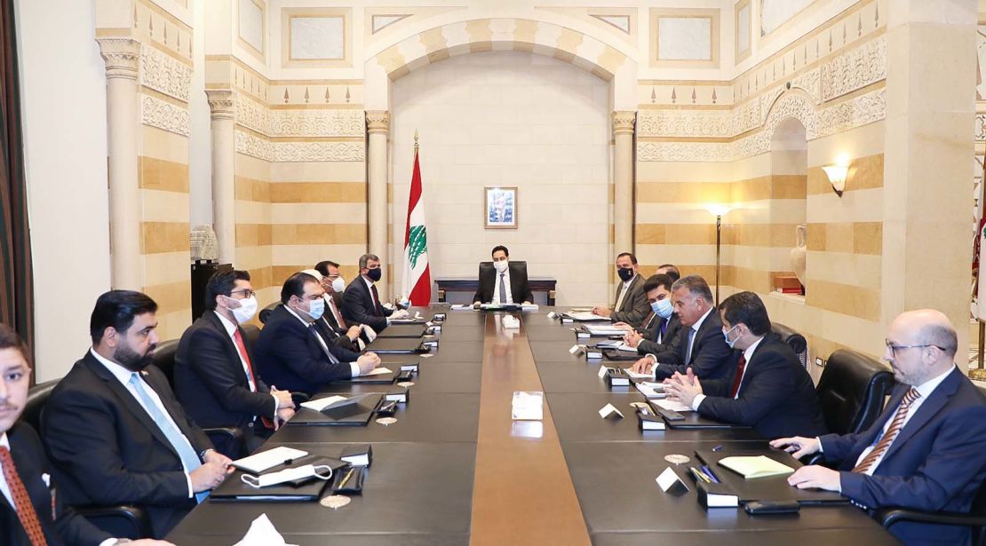 Lebanese Prime Minister Hassan Diab and Iraq's Oil Minister Ihsan Abdel-Jabbara hold a meeting in Beirut on July 3, 2020.