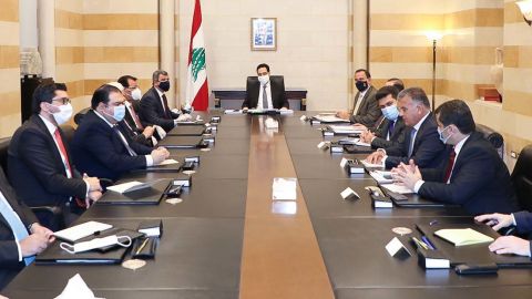 Lebanese Prime Minister Hassan Diab and Iraq's Oil Minister Ihsan Abdel-Jabbara hold a meeting in Beirut on July 3, 2020. 
