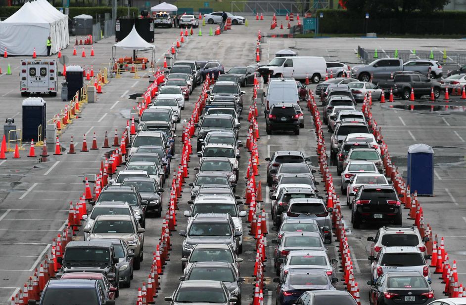 Cars line up in the Hard Rock Stadium parking lot so drivers could be tested in Miami Gardens, Florida, on July 6.