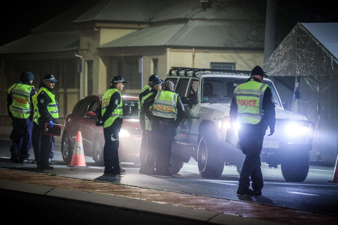 Police stop and question drivers at a checkpoint on July 8 in the Australian border town of Albury.