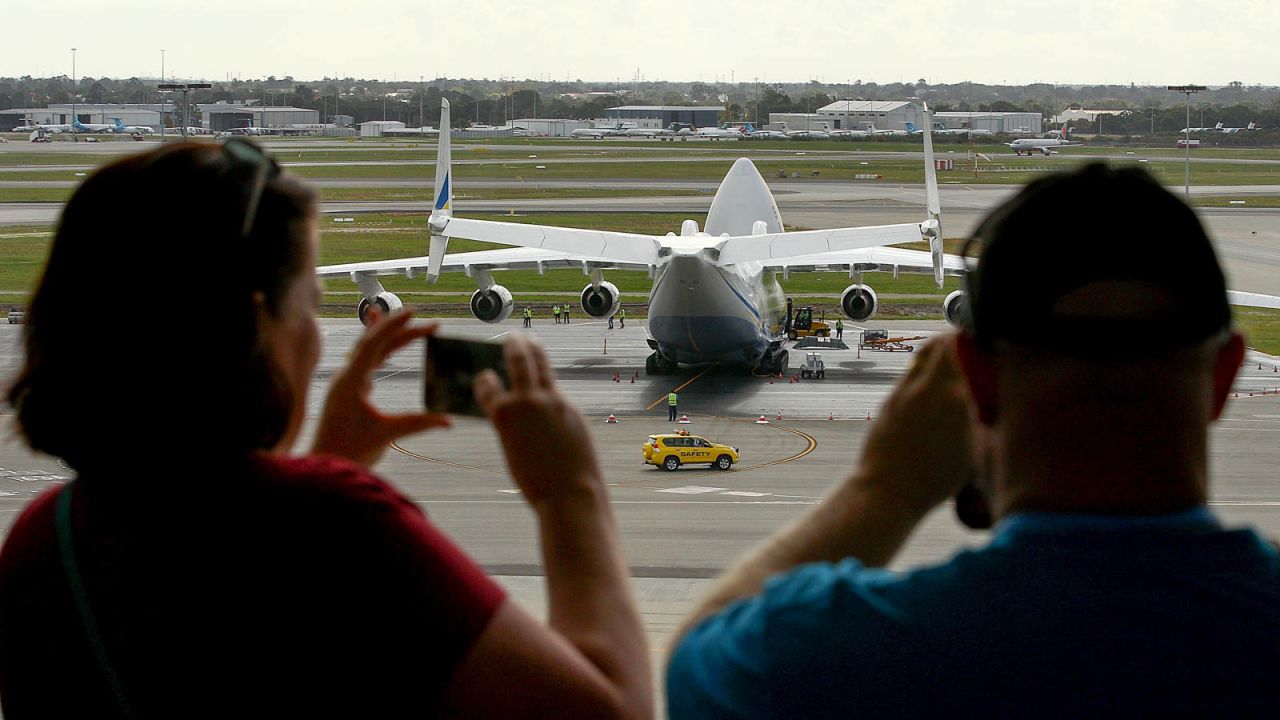 Onlookers video the AN-225 Mriya from the viewing deck at Perth International airport.
