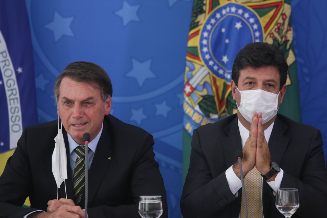 Former health minister Luiz Henrique Mandetta, at right in this photo from March, disagreed with President Jair Bolsonaro, left, over how to tackle the coronavirus pandemic. 