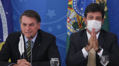 Former health minister Luiz Henrique Mandetta, at right in this photo from March, disagreed with President Jair Bolsonaro, left, over how to tackle the coronavirus pandemic. 