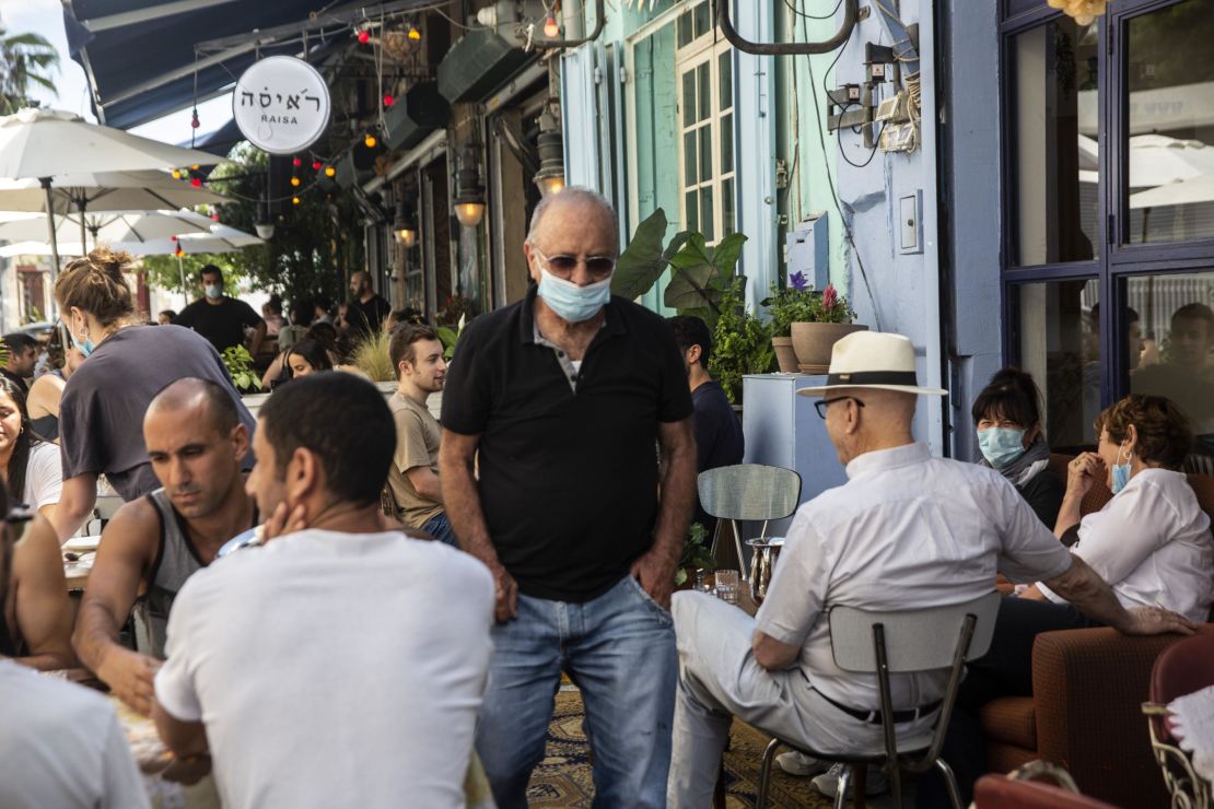 A man wearing a protective mask in a crowded restaurant in Jaffa, Israel, on May 29.