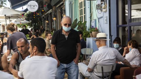 A man wearing a protective mask in a crowded restaurant in Jaffa, Israel, on May 29.