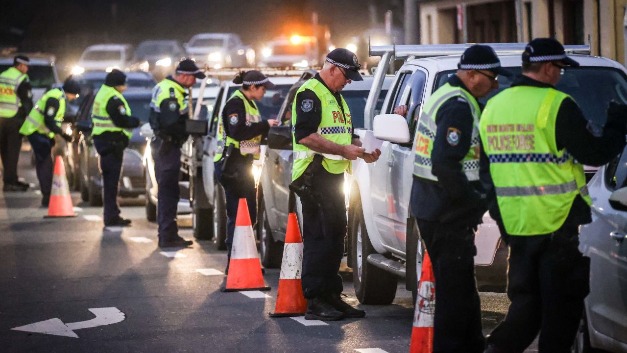 Police stop and question drivers at a checkpoint on July 8 in Albury, Australia.