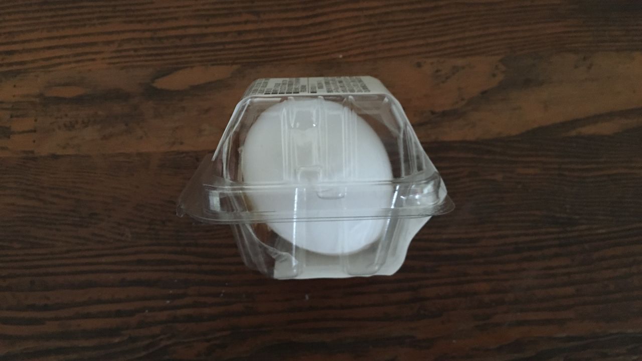 A convenience store hard-boiled egg is protected in plastic packaging. 