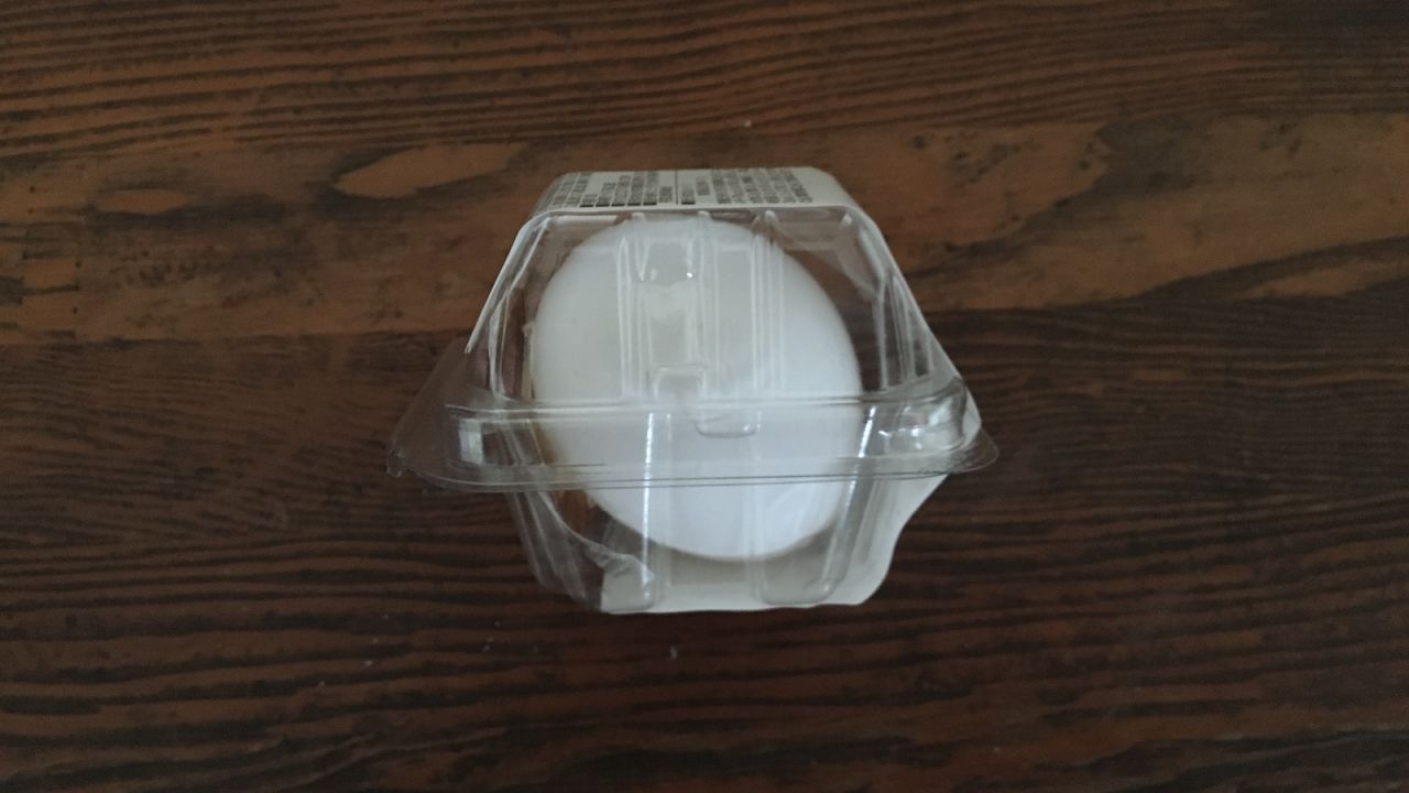 A convenience store hard-boiled egg is protected in plastic packaging.