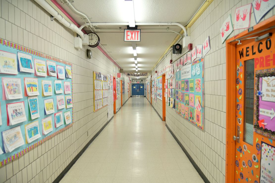 A hallway is empty on what would otherwise be a school day as teachers and faculty members learn remote teaching and methods for students at Yung Wing School P.S. 124 in Manhattan.