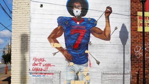 The mural of Colin Kaepernick in Atlanta's West End now has a face mask as part of the grassroots campaign to encourage mask wearing. 