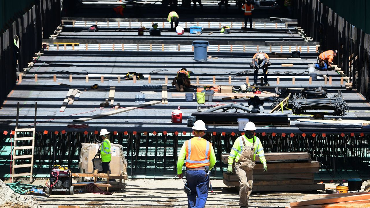 Construction workers build a portion of a high-speed rail line in Fresno, California. (Photo by Frederic J. Brown/AFP/Getty Images)