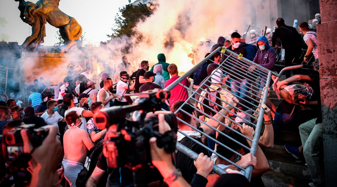 Protesters clash with police in front of Serbia's National Assembly building in Belgrade on July 8. <a href="https://edition.cnn.com/world/live-news/coronavirus-pandemic-07-08-20-intl/h_570a4c52facd841fd36b61439b06ef63" target="_blank">People were demonstrating against President Aleksandar Vucic</a> after he announced a weekend-long curfew to try to combat a surge in coronavirus cases.