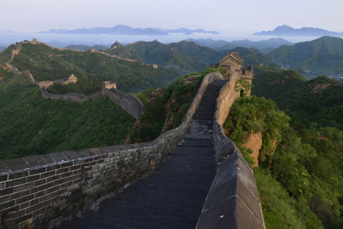 At over 13,000 miles (21,000 kilometers) long, the <a href="index.php?page=&url=https%3A%2F%2Fedition.cnn.com%2Ftravel%2Farticle%2Fchina-great-wall-crack-down%2Findex.html" target="_blank">Great Wall of China</a> is the world's longest man-made structure. Construction began around the 3rd century BCE, and the wall was continuously added to for nearly 2,000 years. During this time, <a href="index.php?page=&url=https%3A%2F%2Fwww.researchgate.net%2Fpublication%2F318704953_The_Ancient_Construction_Materials_and_Methods_The_Great_Wall_of_China_in_Jinshanling_as_a_Case_Study" target="_blank" target="_blank">construction techniques</a> ranged from rammed earth to fired clay bricks held together with a lime and rice mortar.