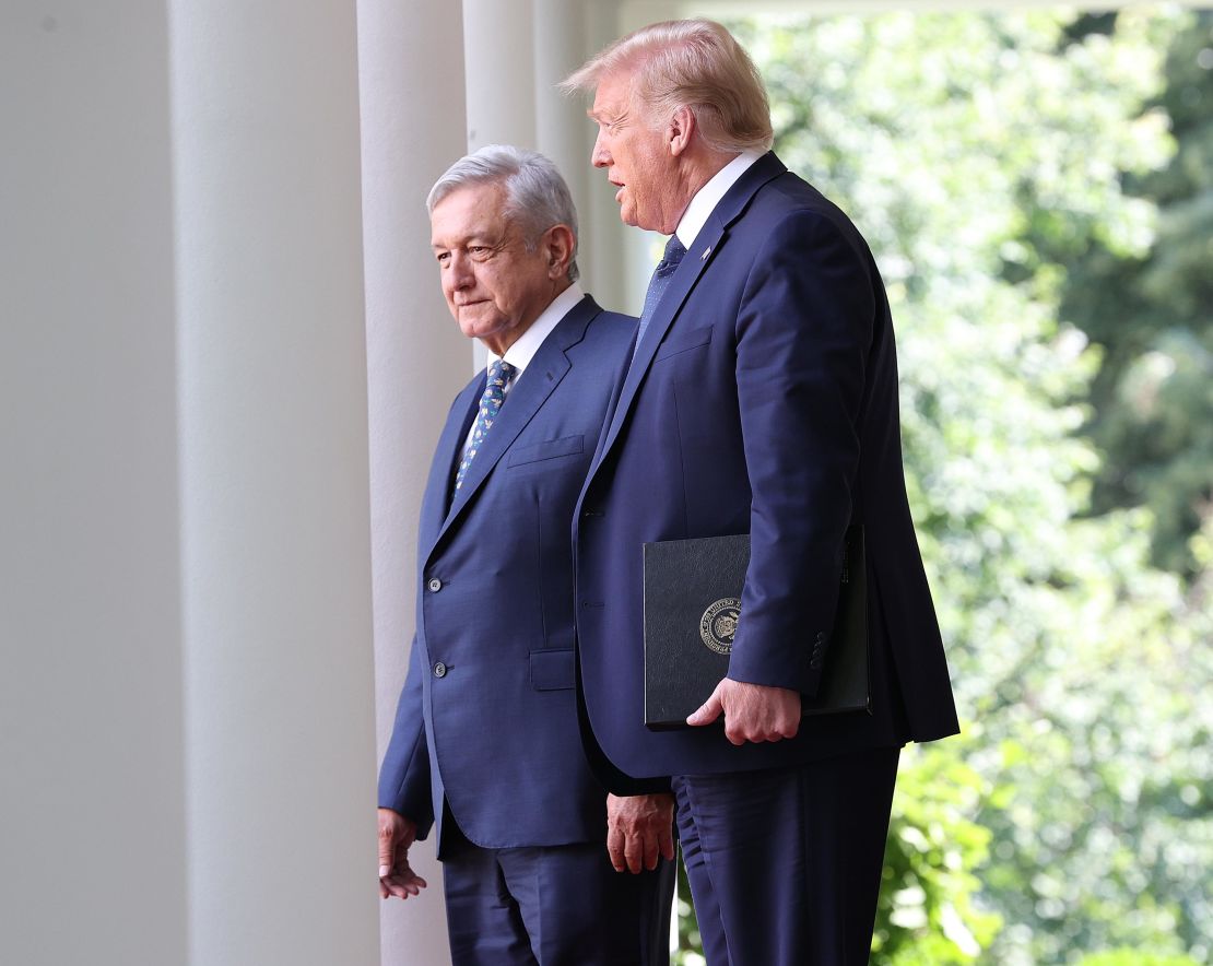 Trump walks to the Rose Garden with Mexican President Andrés Manuel López Obrador.