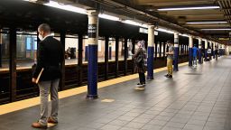 Commuters social distance while waiting for a train at the Fulton Street subway station and complex on July 7, 2020 in lower Manhattan of New York City. 