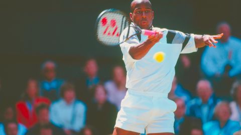 Washington makes a forehand return against Todd Martin during their Wimbledon semifinal in July 1996.