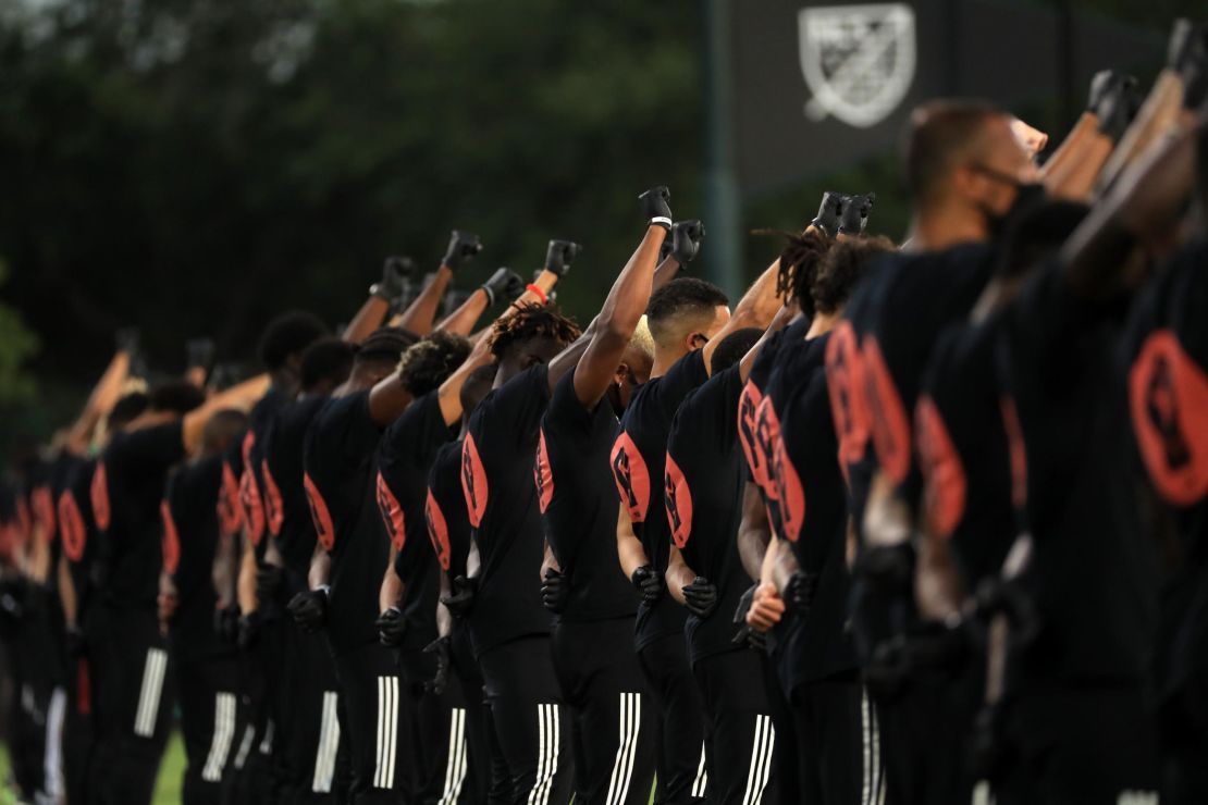 Players of MLS teams participate in a  Black Lives Matter pre-game ceremony before match between Orlando City and Inter Miami as part of MLS is back Tournament at ESPN Wide World of Sports Complex on July 08, 2020 in Reunion, Florida.