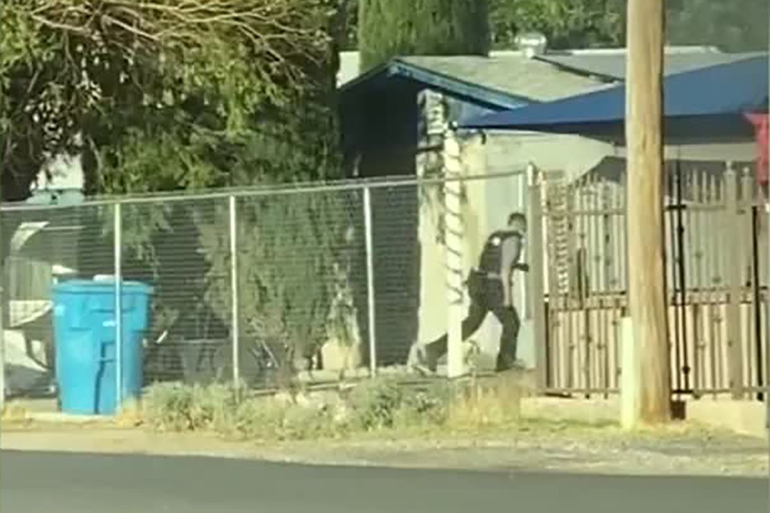 Police officer Joshua Gonzalez running toward the mobile home in Socorro.