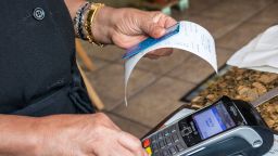 Miami Beach, Tropical Beach Cafe credit card scanner. (Photo by Jeffrey Greenberg/Universal Images Group via Getty Images)