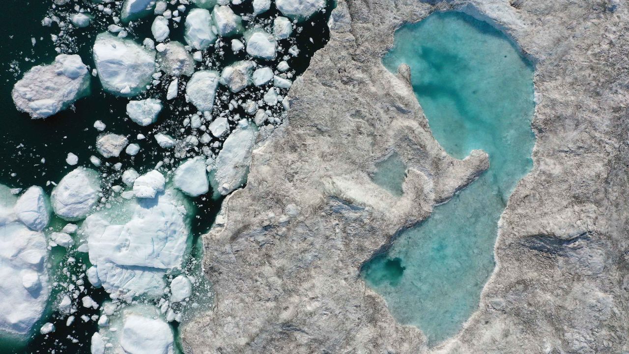 In this aerial view melting ice forms a lake on free-floating ice jammed into the Ilulissat Icefjord during unseasonably warm weather on July 30, 2019 near Ilulissat, Greenland. In 2020, the Arctic is likely to have warmed by more than twice the global mean, a new assesment by the WMO found. 