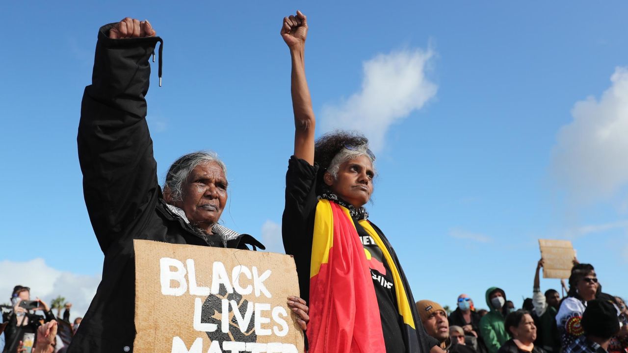 Indigenous protesters show their support during the Black Lives Matter rally in Perth, Australia, on June 13, 2020.